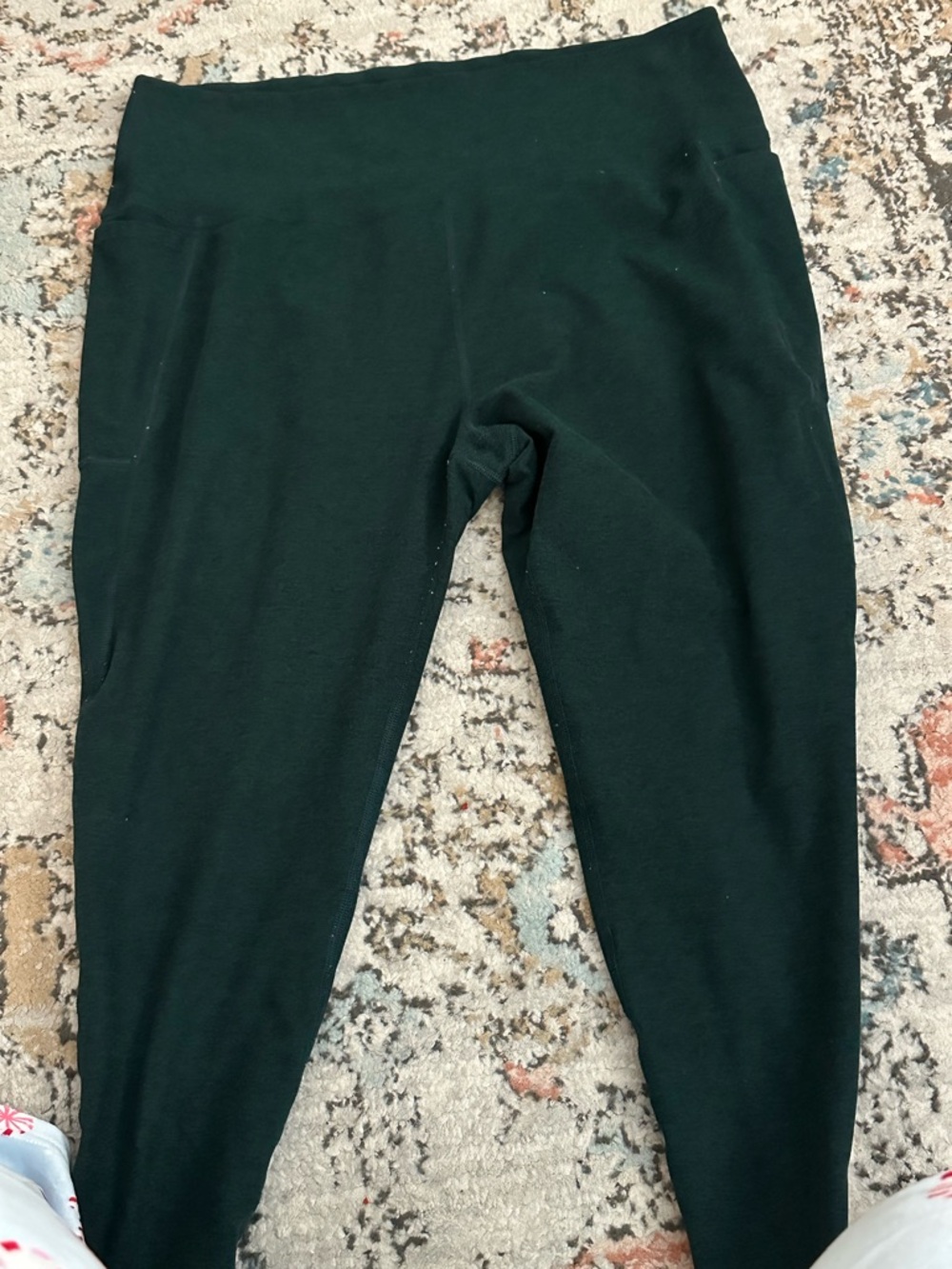 Women’s beyond yoga leggings. Emerald green. Has some wash wear.